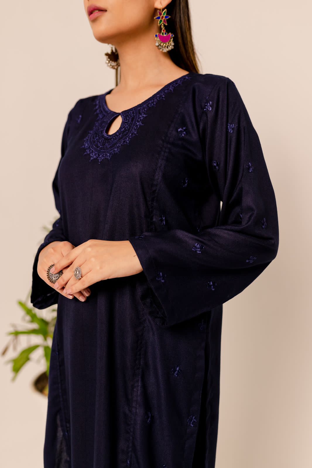 model wearing blue linen embroidered dress